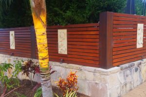 Timber fencing with stonework base
